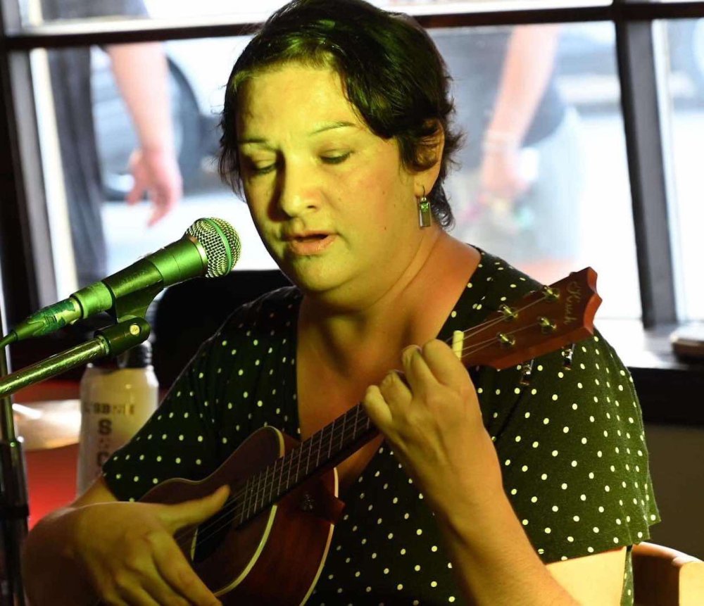 Image of Amy as she plays the Ukelele